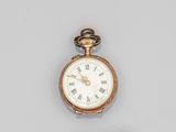a close up of a gold pocket watch with roman numerals