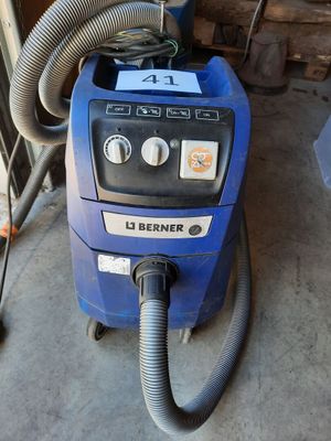 a blue machine that is sitting in the garage