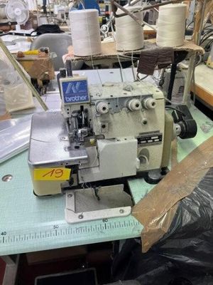 a sewing machine that is sitting on a table in a room