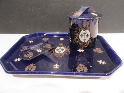 a blue tray with a cup and saucer on it