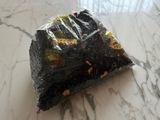 a bag of food sitting on a marble table