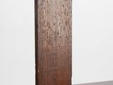 a close up of a wooden cross on a white background