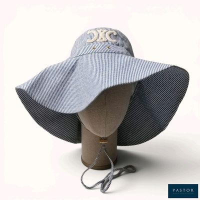 a blue and white striped hat on a mannequin head