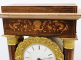a clock that is sitting on top of a table