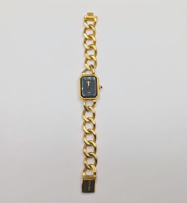 an image of a gold watch with a blue face