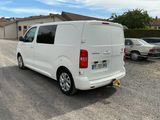a white van that is parked in a parking lot