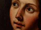 a close up of a painting of a woman ' s face