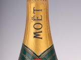 an old bottle of moet champagne sitting on a table