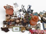 a lot of pottery and other items on a table