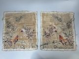two pieces of cloth with animals on them sitting on a table