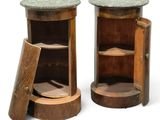 two wooden cabinets with marble tops on each of them