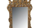une image d'un miroir avec un cadre doré sur un fond blanc