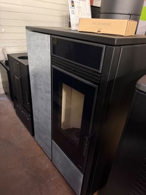 a black stove with a box on top of it