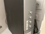 an image of a refrigerator that is in the corner of a room