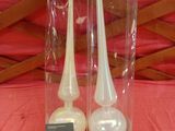 two candles that are in the packaging on the table