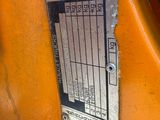 a close up of a metal plate on the side of a motorcycle