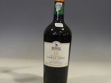 a bottle of wine that is sitting on a table