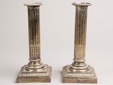a pair of silver plated candlesticks