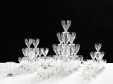 a lot of wine glasses sitting on a table