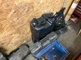 an image of a small air compressor in a garage