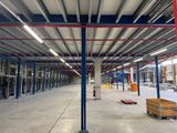 a large warehouse with a lot of steel beams