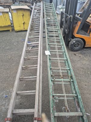 a picture of a forklift with a ladder attached to it