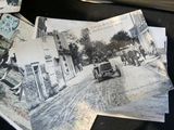 several old black and white photos of people and cars on a street
