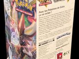 a close up of a box of pokemon cards on a black background