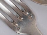 a fork and a spoon sitting on a table
