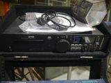 a radio sitting on top of a table next to other electronics