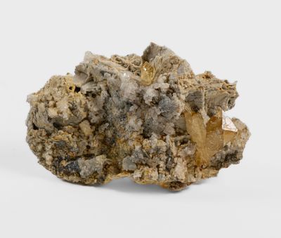 a close up of a piece of rock on a white surface