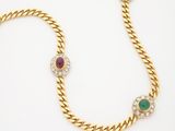 a gold necklace and bracelet set with emerald, ruby, and white stones