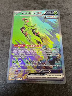 a close up of a pokemon card on a table