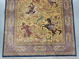 a rug with a picture of a man riding a horse on it