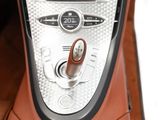 a close up of a car ' s dashboard with a button