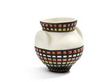 a white vase with a black and red design on it