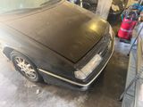 a black car that is parked in a garage