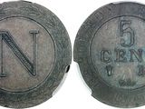 an old coin with the letter n on it and a smaller coin with the letter n on it