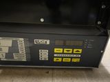 an image of a close up of a machine on a tiled floor