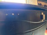 a close up of a black boat in a building
