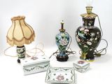 many different types of vases and lamps on the table