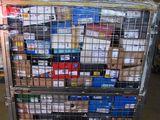 a metal cart with many boxes on it in a warehouse