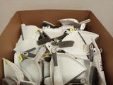 a cardboard box filled with a bunch of different types of brushes