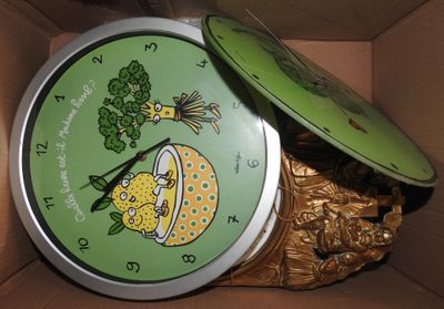 a box with a clock inside of it that has a lid on it
