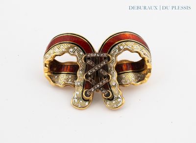 an image of a close up of a red and gold broochle