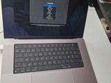 a laptop computer sitting on a desk with a mouse on it