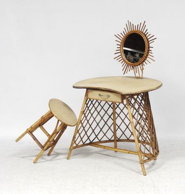 a small desk with a chair and a mirror