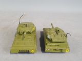 two toy tanks that are sitting on a table