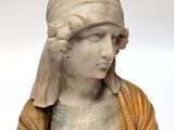 marble bust of a woman with a turban on her head