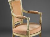 an image of a chair with a beige upholstered seat